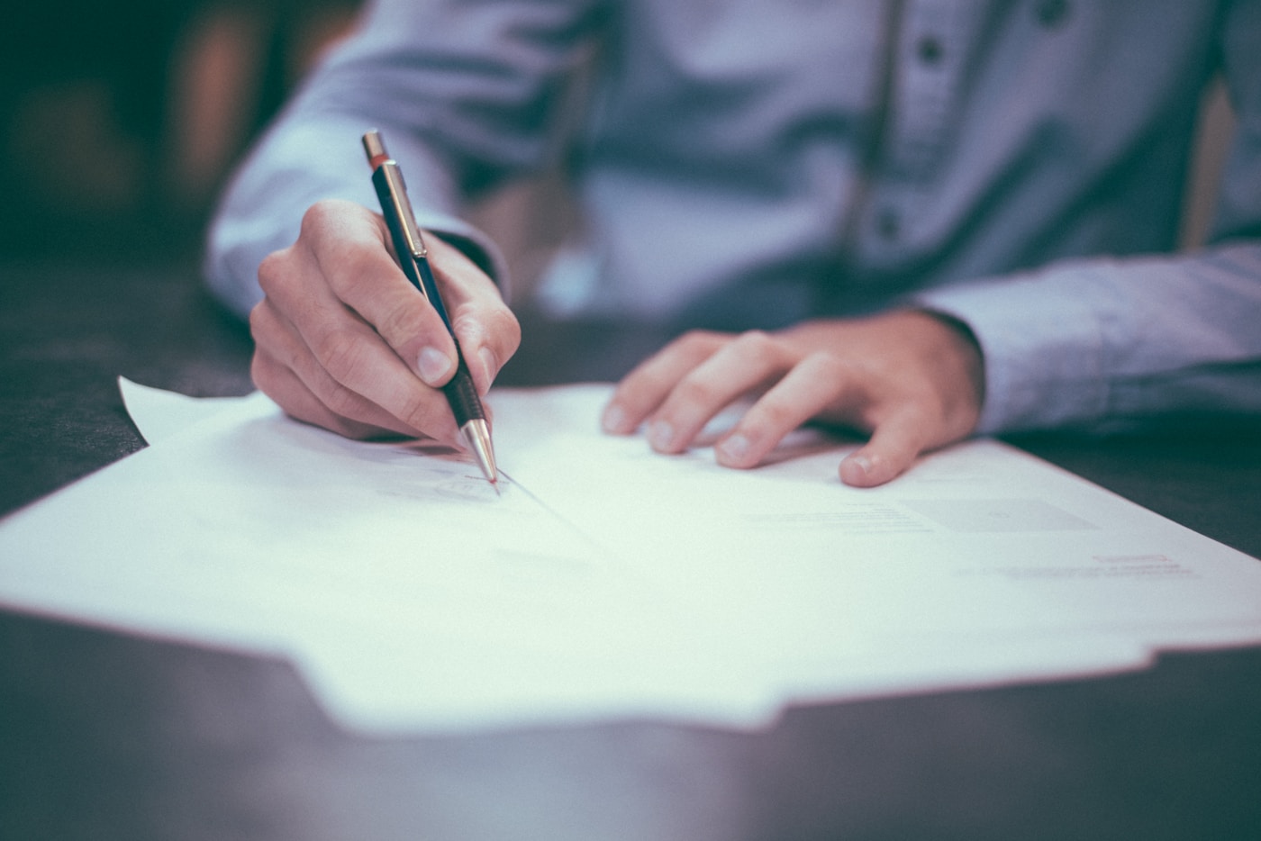 Close detail of a commercial contract and fountain pen